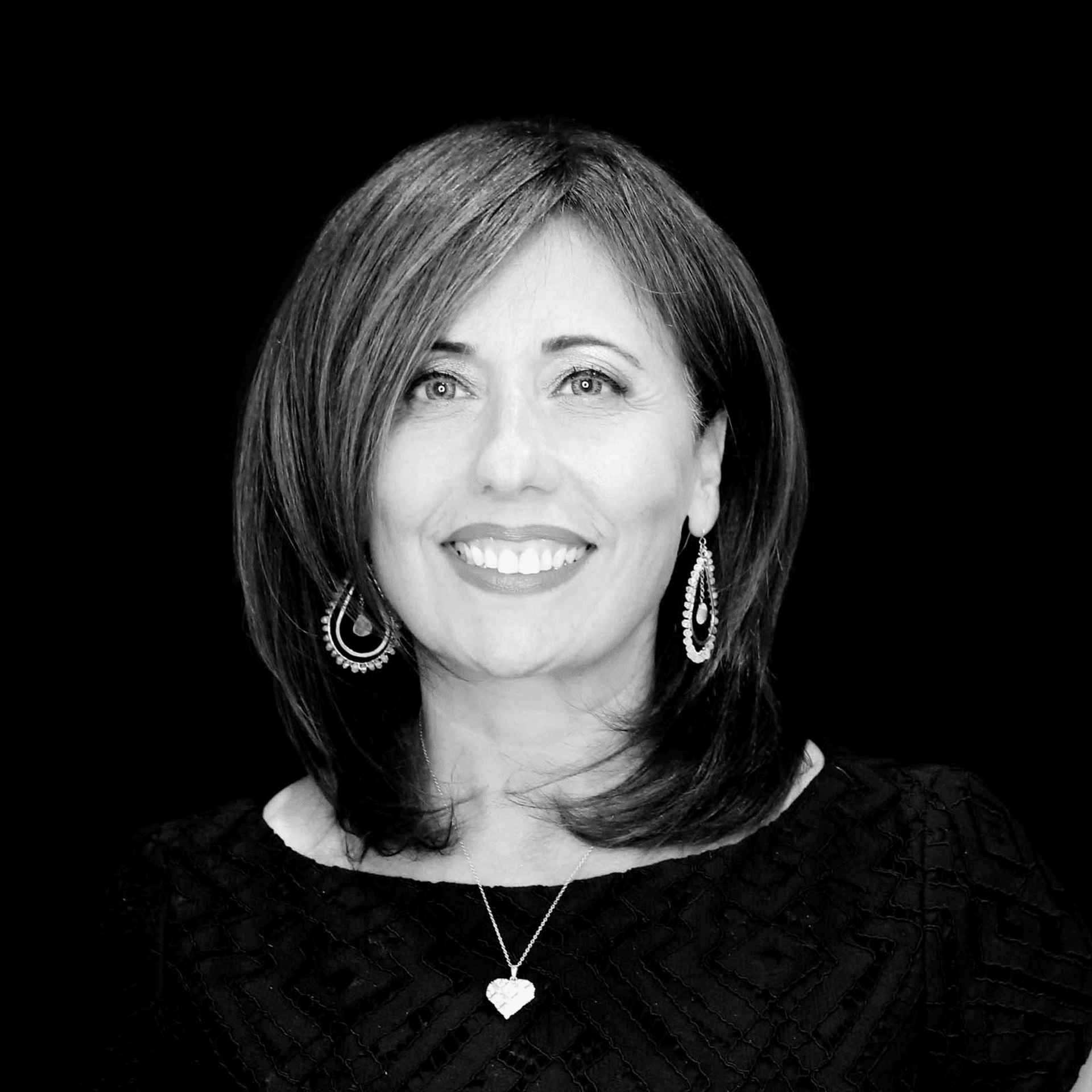 Portrait of Sylvia Vella, a professional stylist at Toka Salon, showcasing their expertise and style.