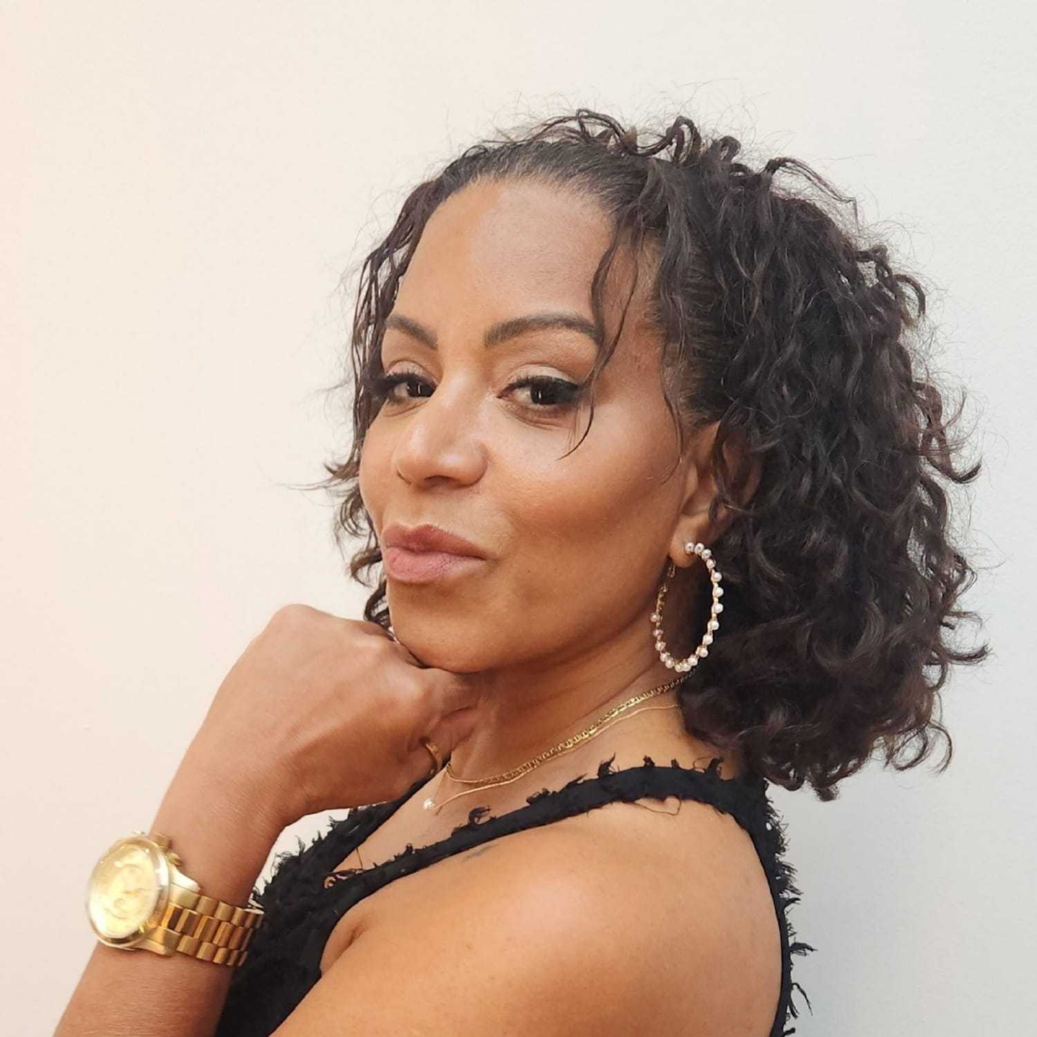 Portrait of Judy Pena, a professional stylist at Toka Salon, showcasing their expertise and style.