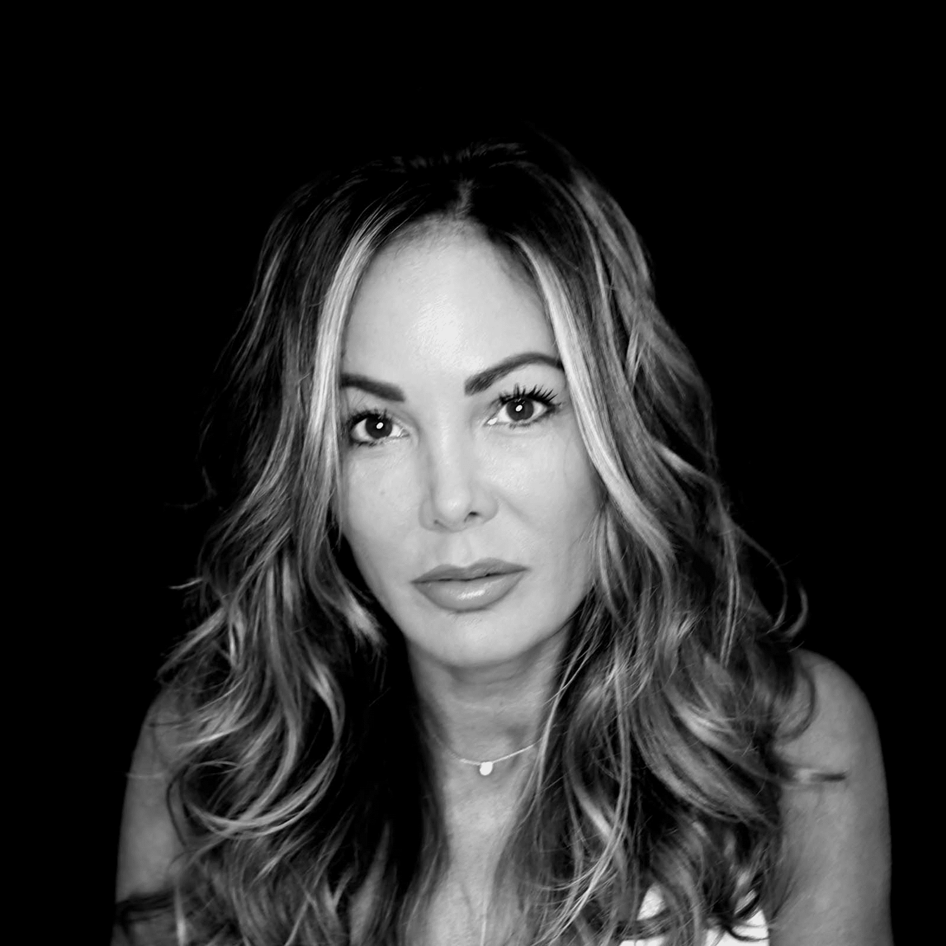 Portrait of Lisa DeGiacomo, a professional stylist at Toka Salon, showcasing their expertise and style.