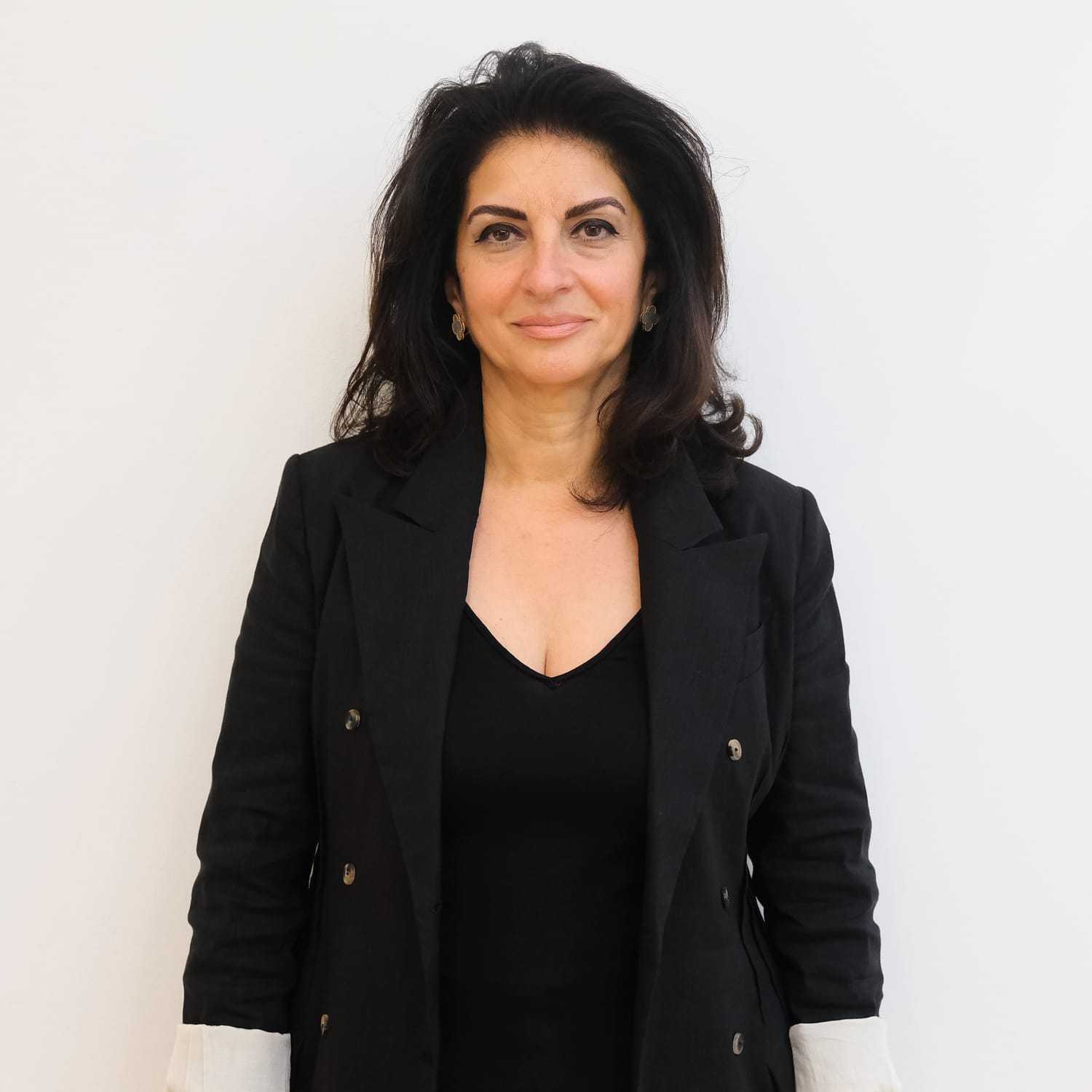 Portrait of Manana Dzhanimanova, a professional stylist at Toka Salon, showcasing their expertise and style.