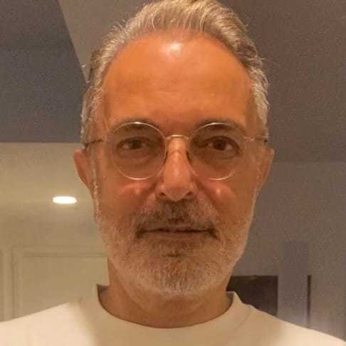 Portrait of Koray, a professional stylist at Toka Salon, showcasing their expertise and style.