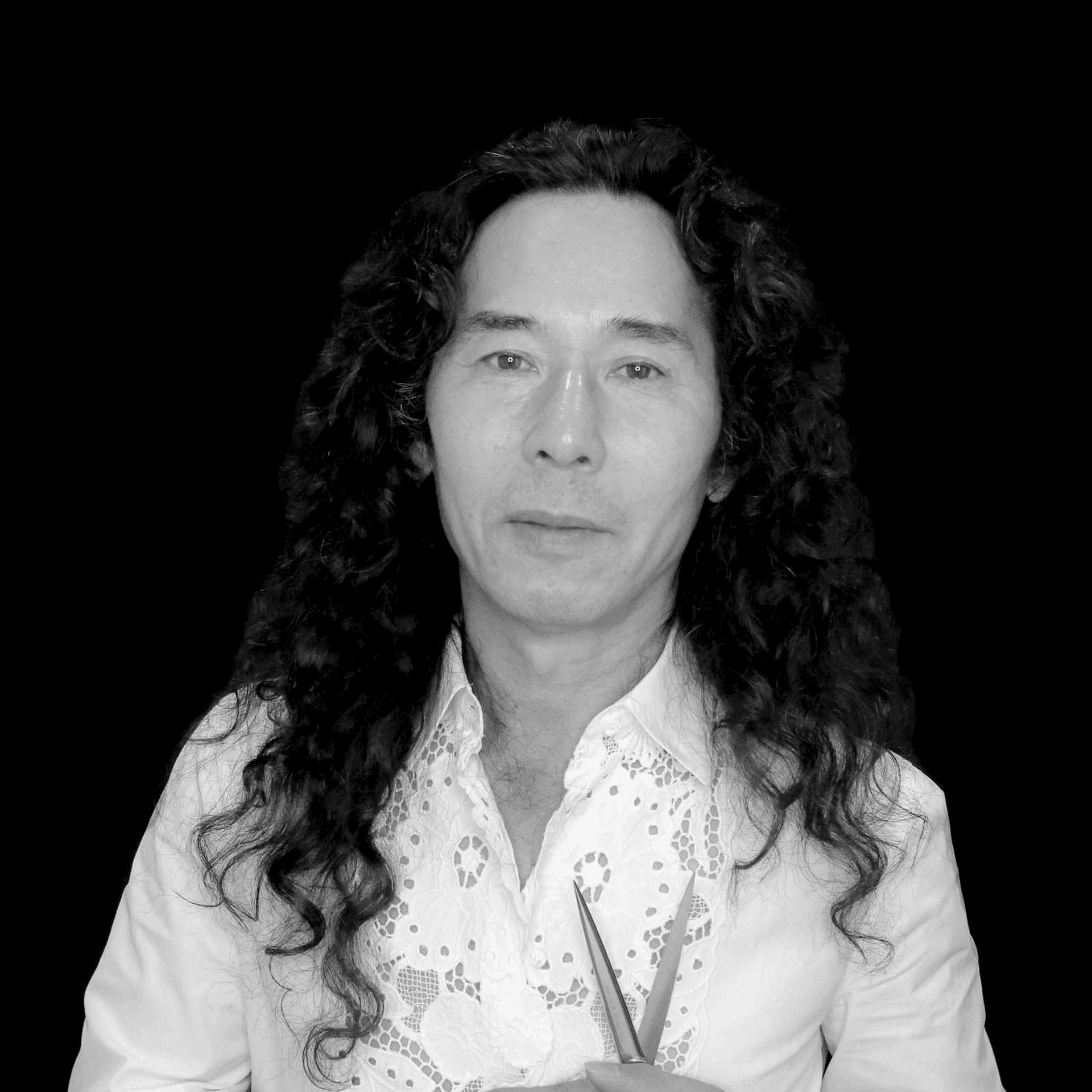 Portrait of Eiji Yamane, a professional stylist at Toka Salon, showcasing their expertise and style.