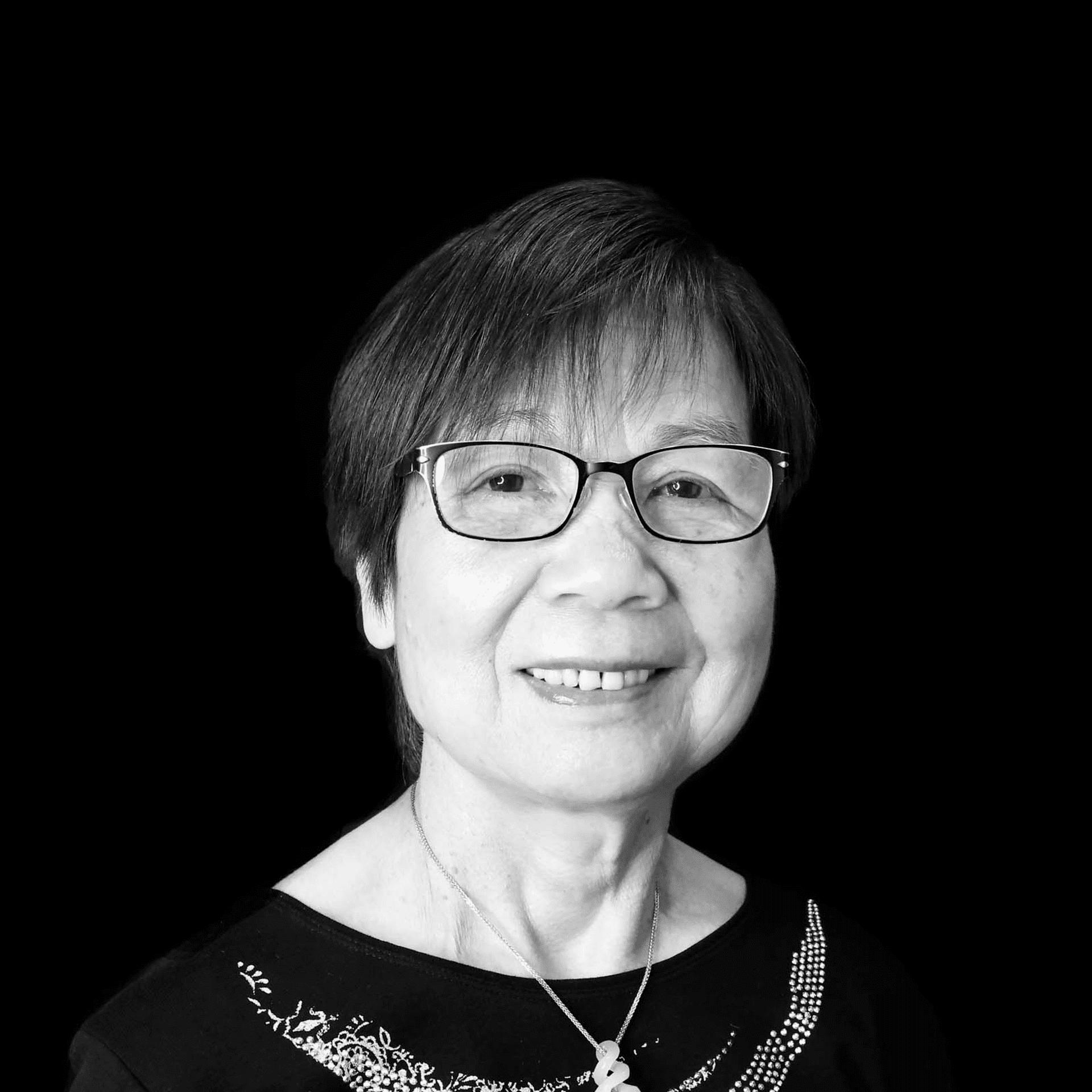 Portrait of Sherly IP, a professional stylist at Toka Salon, showcasing their expertise and style.