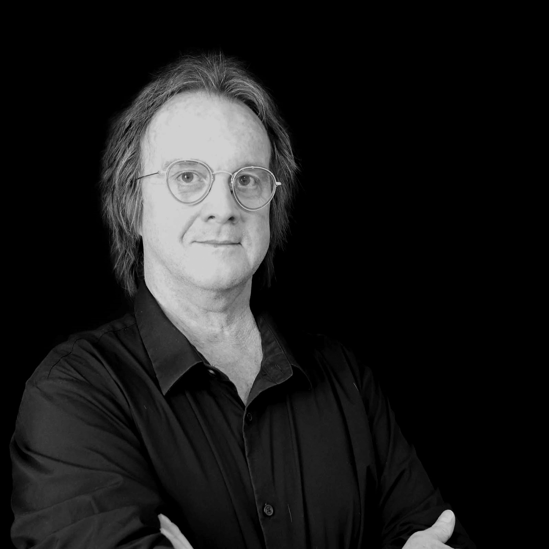 Portrait of Thomas Clency, a professional stylist at Toka Salon, showcasing their expertise and style.