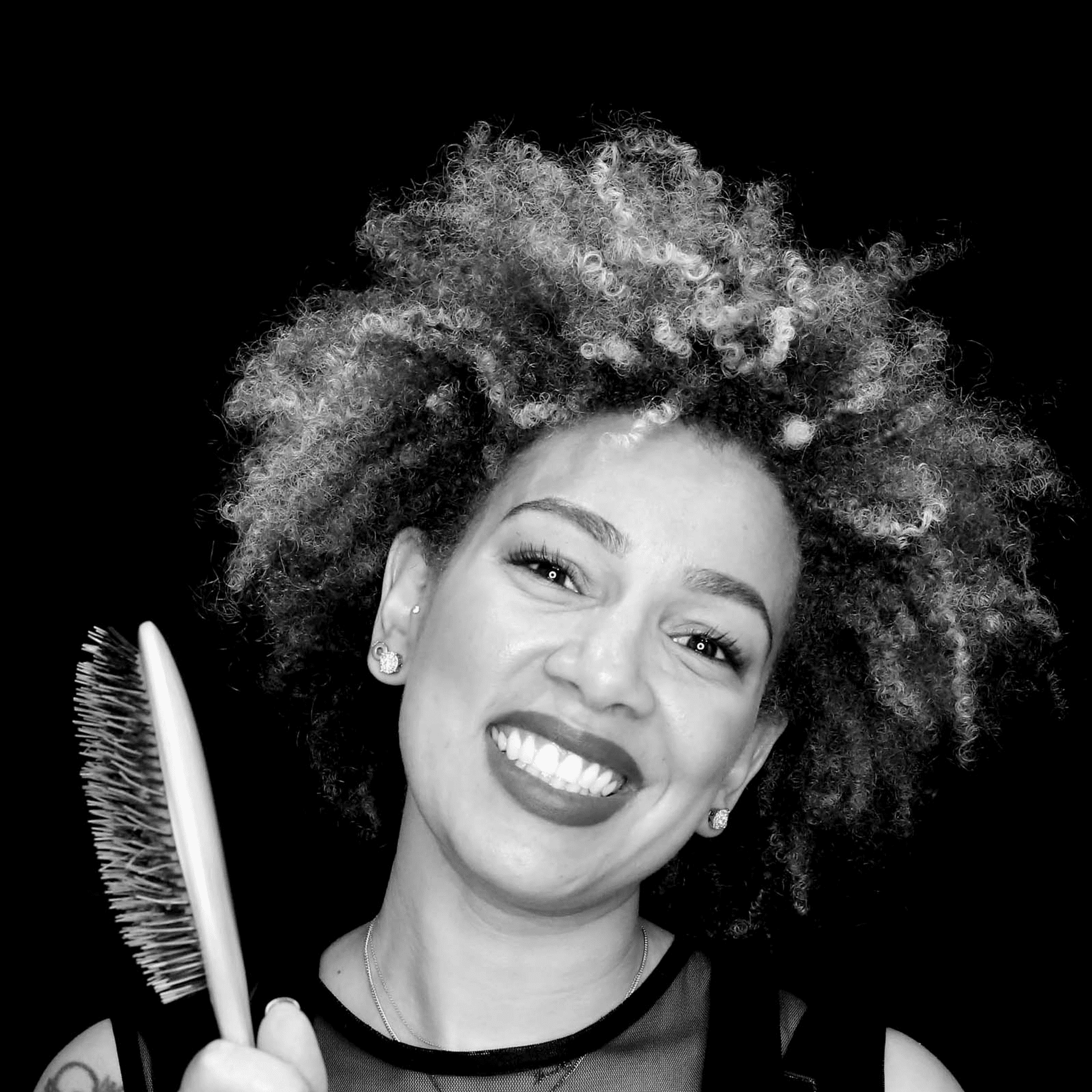 Portrait of Jiset Contreras, a professional stylist at Toka Salon, showcasing their expertise and style.